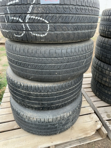 Stack of 20 inch tires on Dodge rims