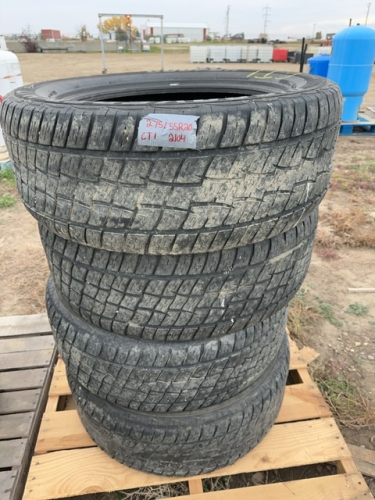 Stack of four truck tires