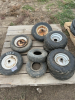 Pallet of lawnmower and small tires and rims