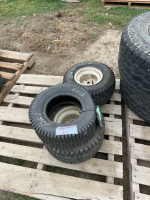 Pallet of lawnmower, tires, and rims