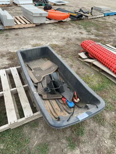 Plastic snow, sled, and contents