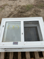 Two exterior windows with screens and sliders