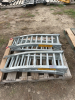 Two galvanized loading ramps