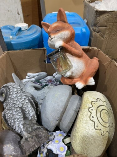 Box of yard ornaments