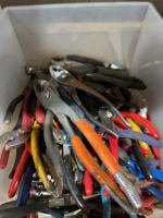 Tub of miscellaneous pliers