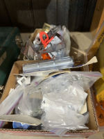 Two boxes of airless sprayer parts