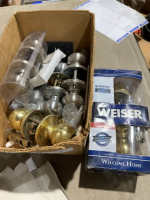 Box of used door knobs