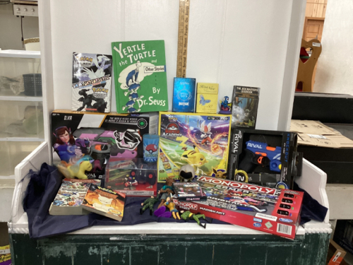 BOX W/ VARIOUS BOARD GAMES, NERF GUNS, POKÉMON BOOKS/CUP/GAME, ACTION FIGURES ETC