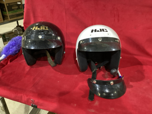 2 MOTORCYCLE HJC HELMETS IN A GOOD LIDDED TOTE