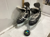 REEBOK HOCKEY SKATES AND A PUCK