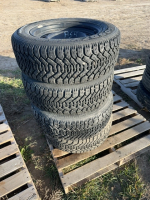 Set of four studded snow tires and rims