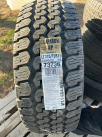 One chaparral tire on aluminum 8 bolt rim