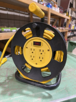 Extension wire spool with plug in