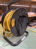 Extension cord, spool outlets