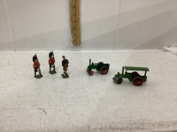 MINI COLLECTIBLES - (2) LEAD SOLDIERS AND A SCOTTISH PIPER. + (2) ANITQUE TRACTORS