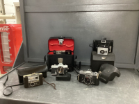 COLLECTION OF VINTAGE CAMERA'S IN CASES