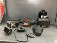 COLLECTION OF VINTAGE CAMERA'S IN CASES