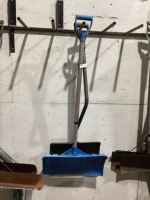 2 SNOW SHOVELS - PLASTIC - ONE HAS METAL HANDLE THE OTHER WOOD