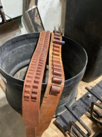 2 AMMUNTION BELTS IN A TUB W/HOLES