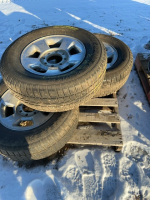 Three Cooper studded tires on Dodge eight bolt rims