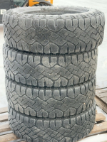 Stack of four Goodyear tires