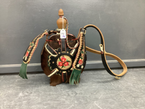 HIDE ON COVERED FLASK W/ STITCHED FLORAL DETAIL