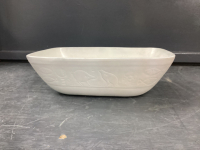 SUNBURST WHITE POTTERY BOWL W/ SOME ENGRAVING AROUND THE EDGES