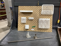 OFFICE ORGANIZERS ON PEGBOARD, BRUSHED CHROME TOWEL BAR